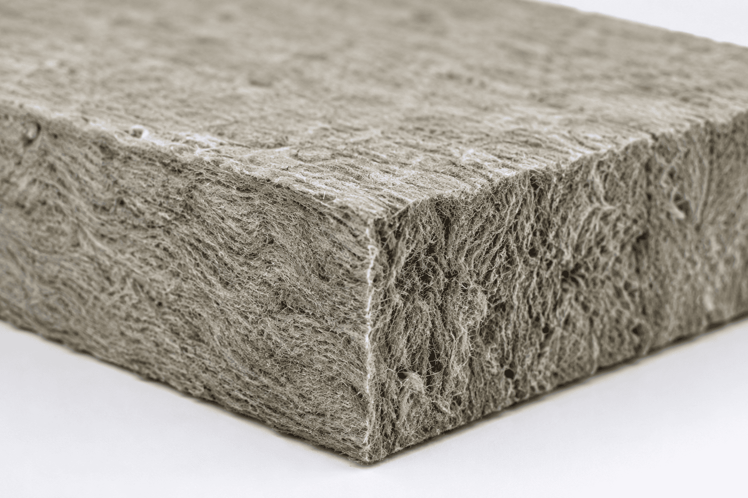 Steinwolle Dämmung: Nahaufnahme einer Mineralwolleplatte mit grauer Faserstruktur für Wärme- und Schalldämmung im Hausbau